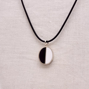 
            
                Load image into Gallery viewer, Black &amp;amp; White Halves Silver Oval Pendant
            
        