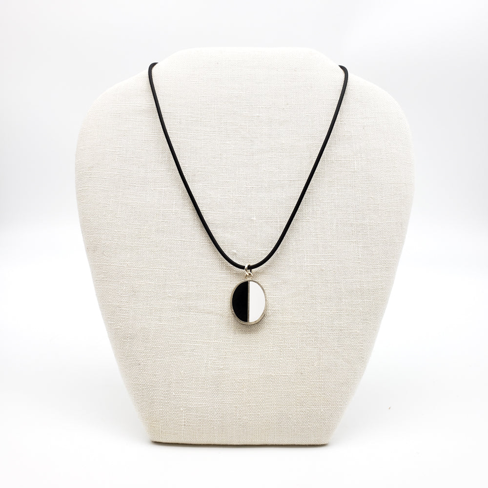 
            
                Load image into Gallery viewer, Black &amp;amp; White Halves Silver Oval Pendant
            
        