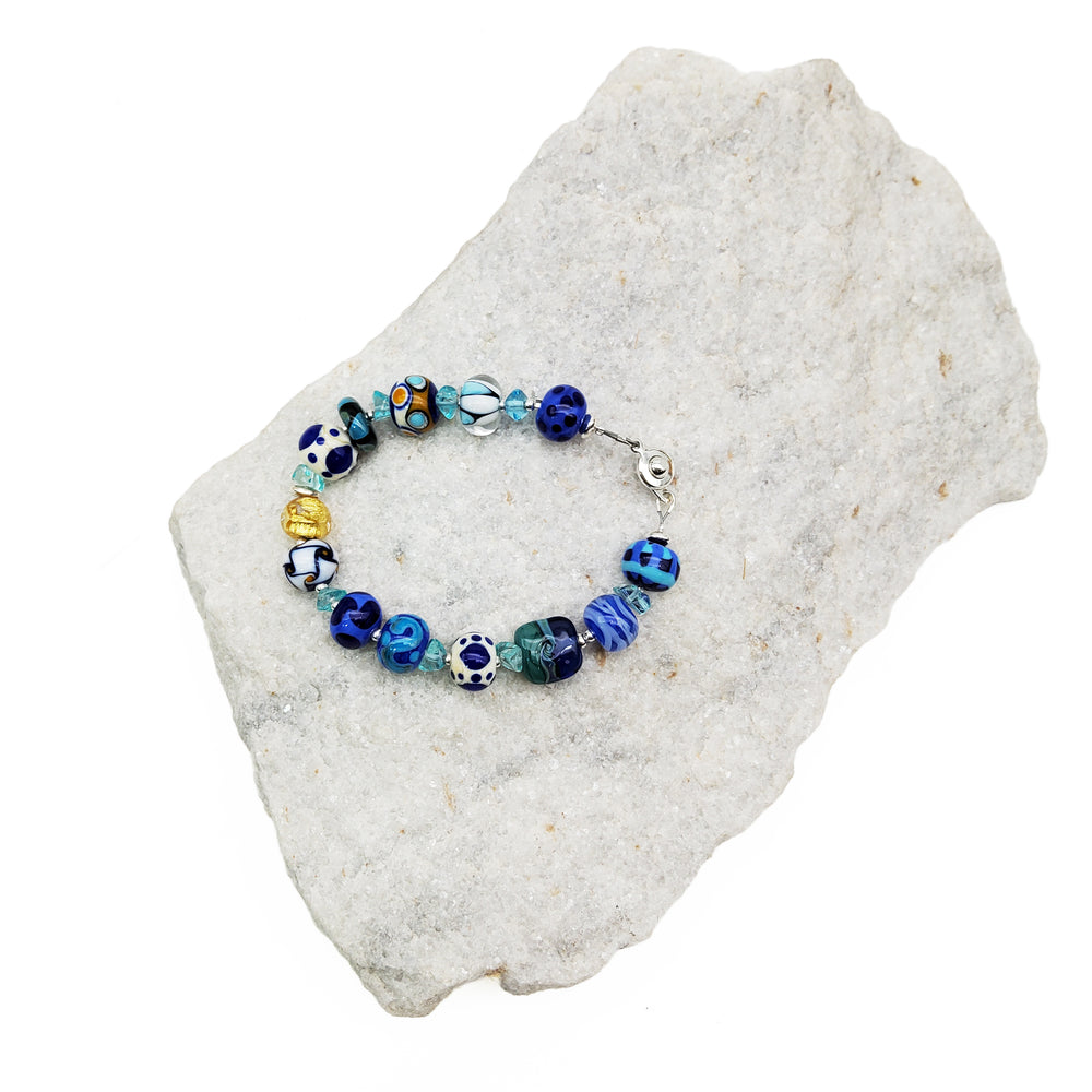 
            
                Load image into Gallery viewer, Blue and White Glass Bead Bracelet
            
        